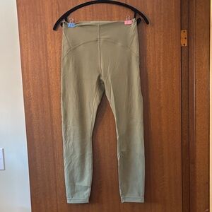 Women's instill Leggings olive green in color
